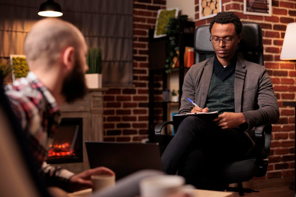 A therapist listening to a client